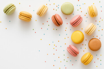 Obraz premium Colorful Macarons with Sprinkles on White Background for Celebration
