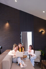 Asian Women Shopping Online Using Laptop in Modern Living Room Three Young Adult Friends Enjoying Online Purchase Together