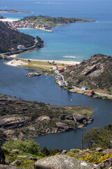 Panoramic view from &Eacute;zaro viewpoint in Dumbr&iacute;a, Galicia, Spain, where the Xallas River meets the Atlantic Ocean in a dramatic coastal landscape.