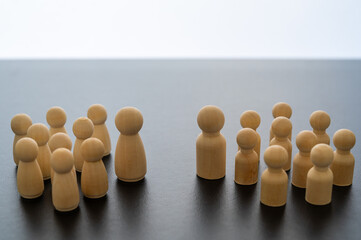 Conceptual representation, with wooden pawns, of gender differentiation and struggle. Males versus...