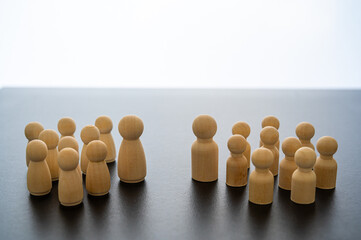 Conceptual representation, with wooden pawns, of gender differentiation and struggle. Males versus...