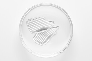A sample of cosmetic moisturizing or anti-aging cream in a petri dish.