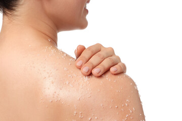 Woman applying body scrub onto her shoulder against white background, back view