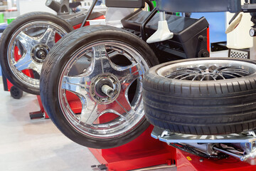 Tire fitting of automobile wheels on modern equipment in a car service