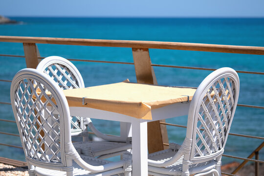 View of alfresco table at the beach. Summer vacation, relaxation, travel concept.