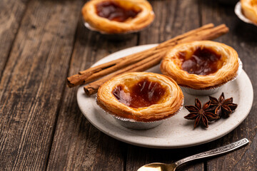 Traditional Portuguese custard tarts or Pastel de Nata freshly baked cream dessert. High quality photo