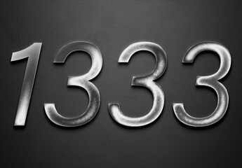Chrome metal 3D number design of 1333 on grey background.