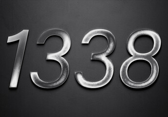 Chrome metal 3D number design of 1338 on grey background.