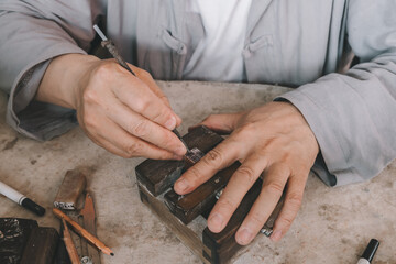 Traditional Chinese Woodblock Carving in Progress