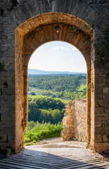 Scenic view of the countryside at Porta San Giovanni, St John's Gate, in the small medieval town of Monteriggioni, Southern Tuscany, Italy.