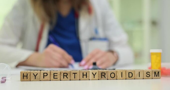 Female professional documents Hyperthyroidism treatment prescription sitting at desk. Medical diagnosis and treatment of hyperthyroidism in clinic