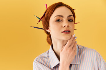 Creative woman using colorful pencils in a playful style against a bright yellow background