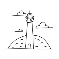 Fototapeta premium A tower beside a hill with a clear sky background
