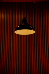 Close-up of the lighting indoors. Light bulb. Interior design, decoration. Lighting equipment.
