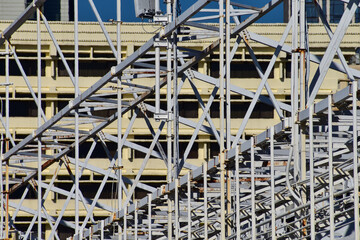 Metal scaffolding, used as temporary structure to support at the construction site. Construction concept. Construction equipment.