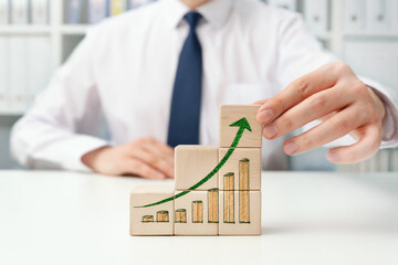 Growing business concept with wooden blocks