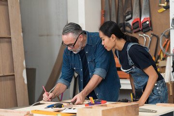 Carpenter, Wood workshop. Two carpenter making furniture from wood together in carpenter wood factory