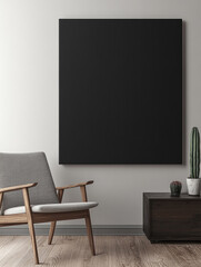 A modern, minimalist interior features a large black canvas on a light gray wall and with a beige armchair.