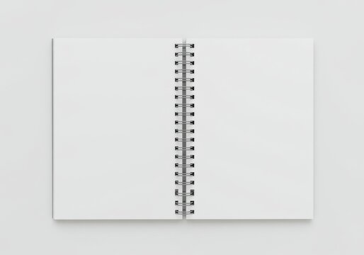 Opened notebook with blank pages and spiral binding