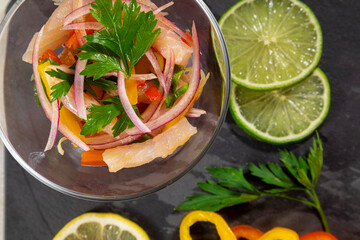 Peruvian ceviche is a traditional dish consumed in Peru. The preparation method is different from other places, using lemon, fish, potatoes, onion, seaweed, corn, chili, ginger, milk, sweet potato