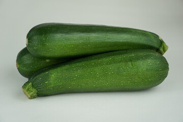 Fresh green zucchini isolated on white background