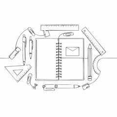 An organized collection of stationery items with a notebook at the center 