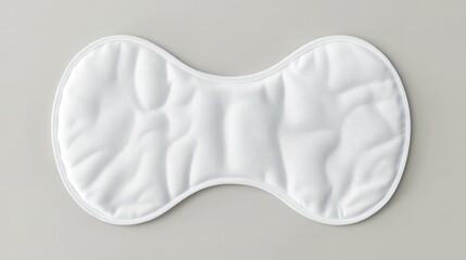 White cotton neck pillow, studio shot, gray background, relaxation