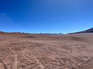 Vast and dramatic aerial view of the Atacama Desert in Chile, one of the driest places on Earth, with unique terrain and colors