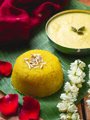 A traditional Indian sweet dish beautifully presented on a banana leaf, this image showcases Kesari...