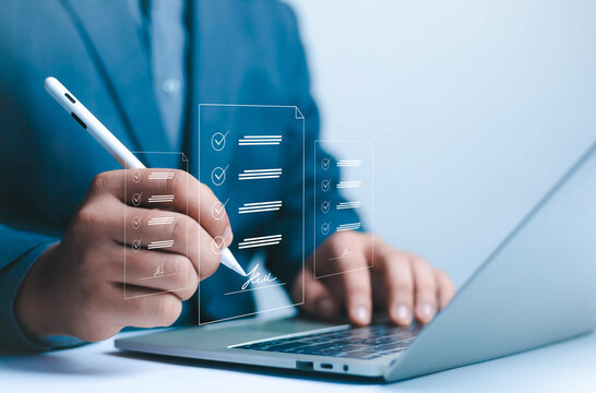 Electronic signature Businessman signs electronic document on digital document on page Electronic signature concept Writing business agreement Digital document management Paperless office	

