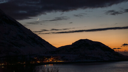 Nordic dusk with ashen light over silhouetted hills