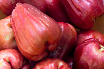 Rose apple fruit (syzygium jambos) isolated on white background. Rose apples have a variety of...