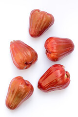 Rose apple fruit (syzygium jambos) isolated on white background. Rose apples have a variety of...