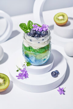 Healthy yogurt parfait with kiwi and blueberry garnish