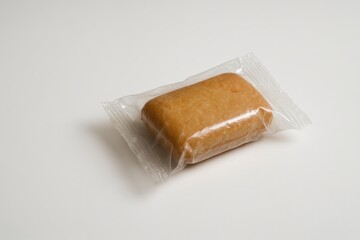 Delicious sweet treat wrapped in clear plastic packaging ready for enjoyment