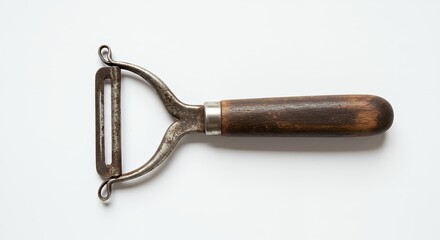 Vintage metal peeler with wooden handle