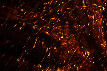 Fiery Sparkles and Glowing Particles Overlay with Bright Heat and Flickering Light Effects in Dark Background