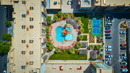 Aerial Resort Pool Tennis Court and Palm Trees Top Down Flyover