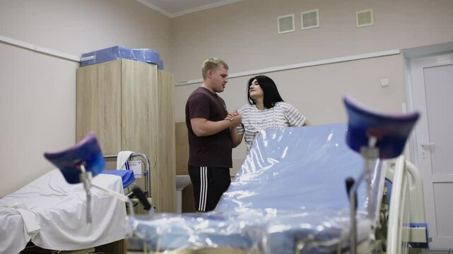 Husband and wife during labor in the delivery room. The concept of childbirth and joint labor.