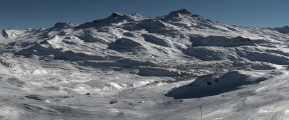 In the Austrian state of Tyrol, Seefeld showcases a wide and picturesque winter landscape with the snow-covered Alps as its focal point
