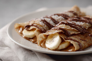 Delicious vegan chocolate banana crepes with almond butter