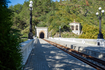 The railway station is reached from a tunnel, climbing up the mountainside. The resort town of Gagra, located on the Black Sea coast in Abkhazia.