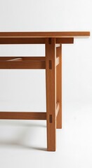 Close-up of light-brown wooden table's leg and top