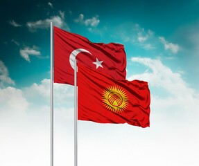  National flags of Turkey and Kyrgyzstan wave side by side in a clear blue sky symbolizing...