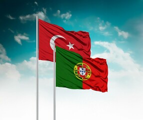  National flags of Turkey and Portugal wave side by side in a clear blue sky symbolizing...