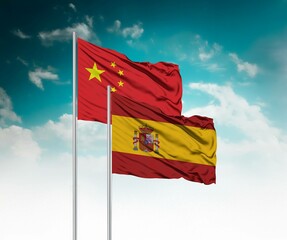  National flags of China and Spain wave side by side in a clear blue sky symbolizing international...