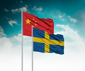  National flags of China and Sweden wave side by side in a clear blue sky symbolizing international...