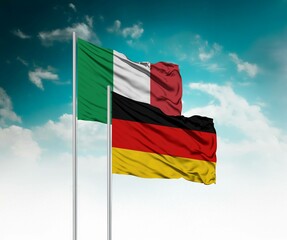  National flags of Italy and Germany wave side by side in a clear blue sky symbolizing...