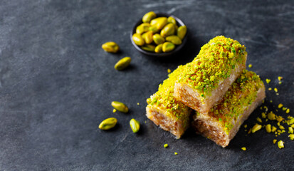 Turkish baklava. Dark grey background. Close up. Copy space.