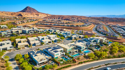 Aerial Modern Desert Homes with Pools and Mountain Backdrop Fly Through